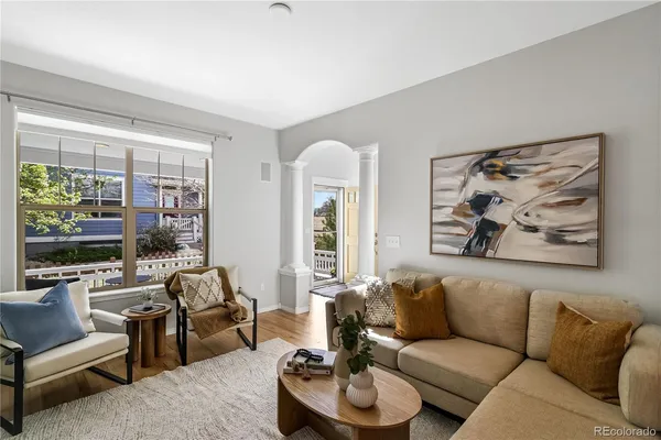 a living room with furniture and a large window
