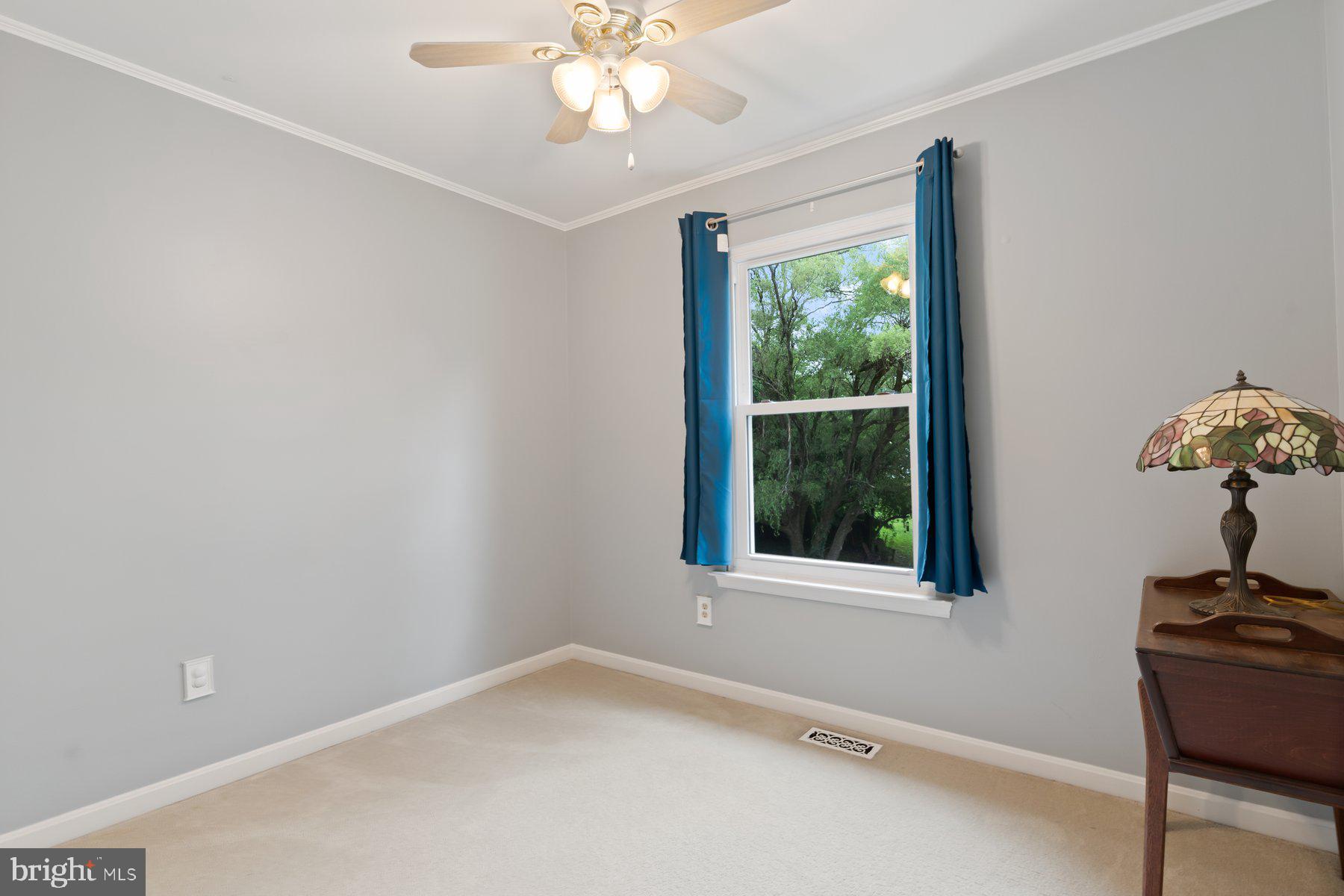 6571 11th Street Chesapeake Beach, MD 20732 - Photo 13 of 36 an empty room with a window