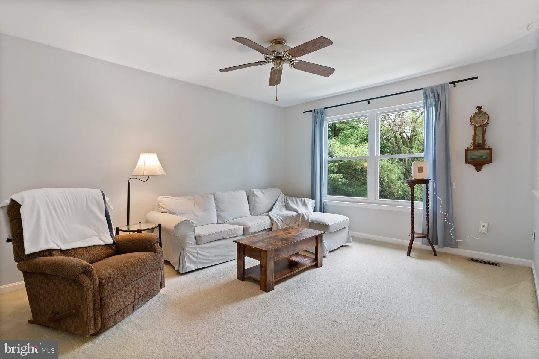 6571 11th Street Chesapeake Beach, MD 20732 - Photo 2 of 36 a living room with furniture and a window