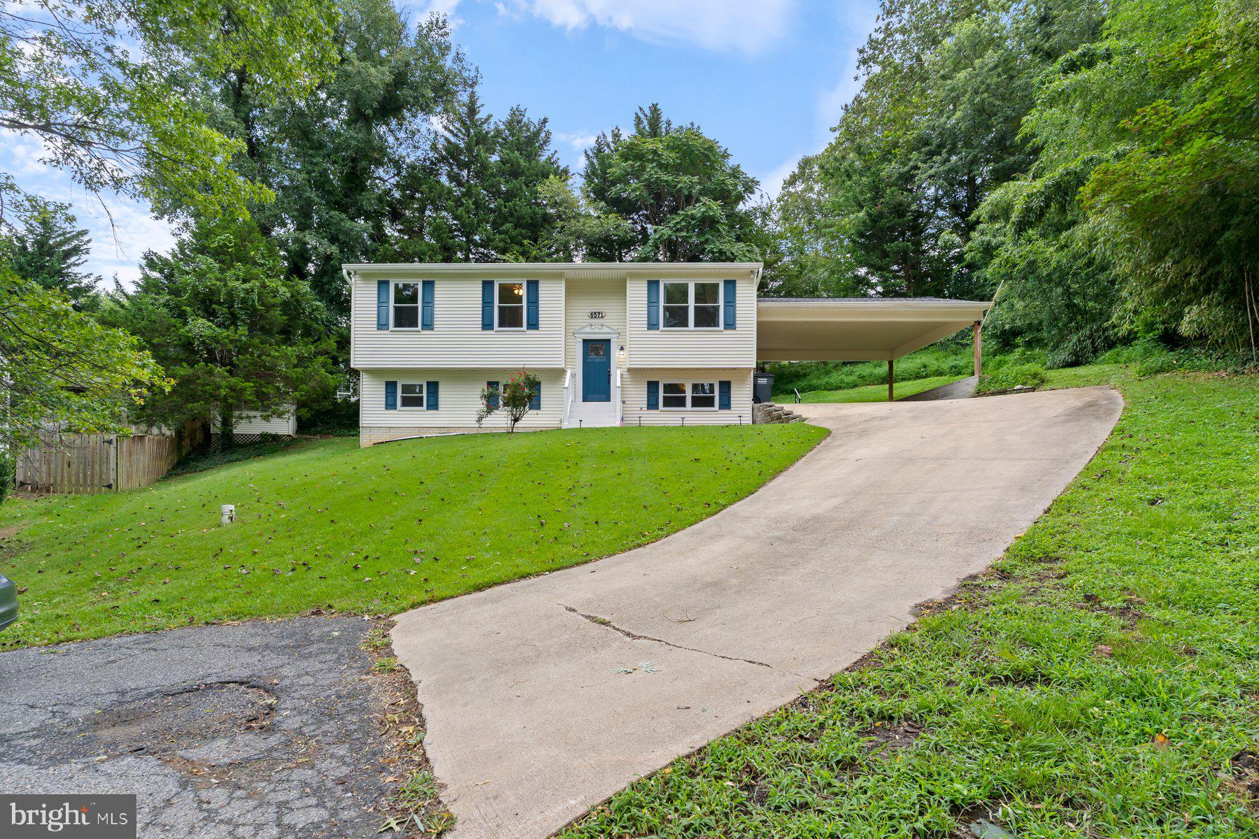 6571 11th Street Chesapeake Beach, MD 20732 - Photo 25 of 36 a front view of a house with a yard and trees