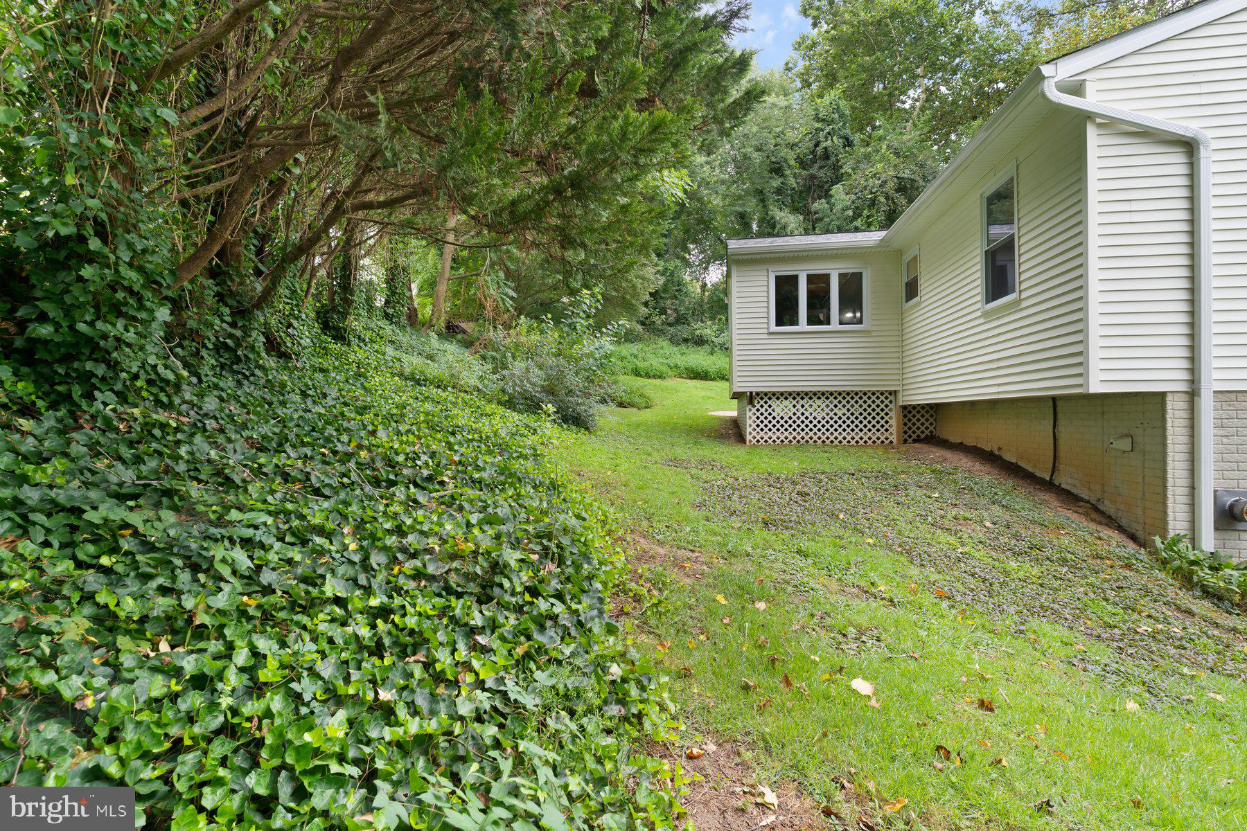 6571 11th Street Chesapeake Beach, MD 20732 - Photo 29 of 36 a view of a house with a backyard