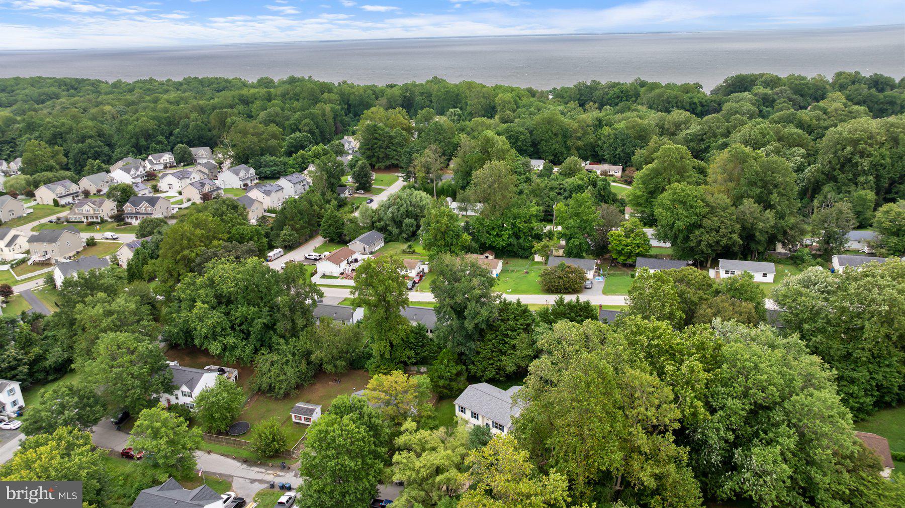 6571 11th Street Chesapeake Beach, MD 20732 - Photo 31 of 36 a view of a garden with a building in the background