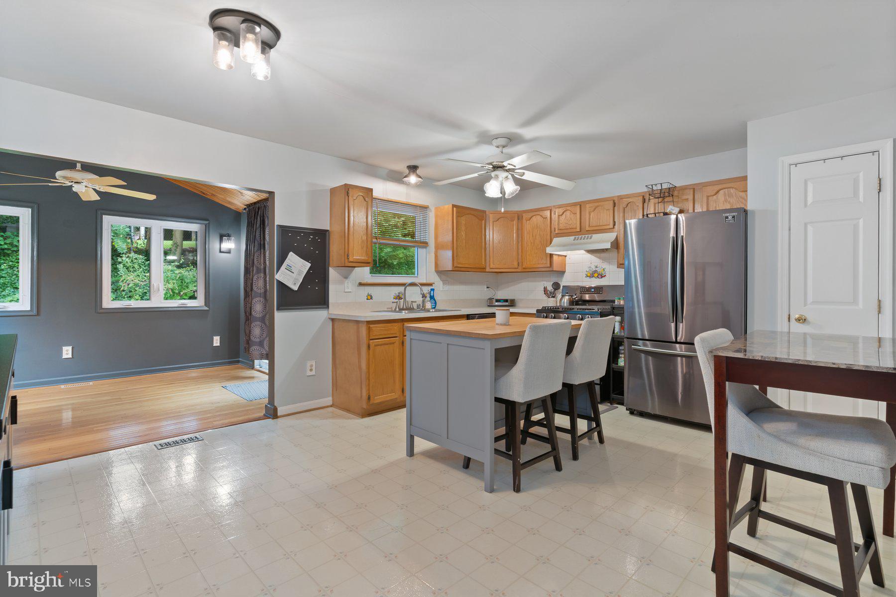 6571 11th Street Chesapeake Beach, MD 20732 - Photo 4 of 36 a view of kitchen with furniture and a refrigerator