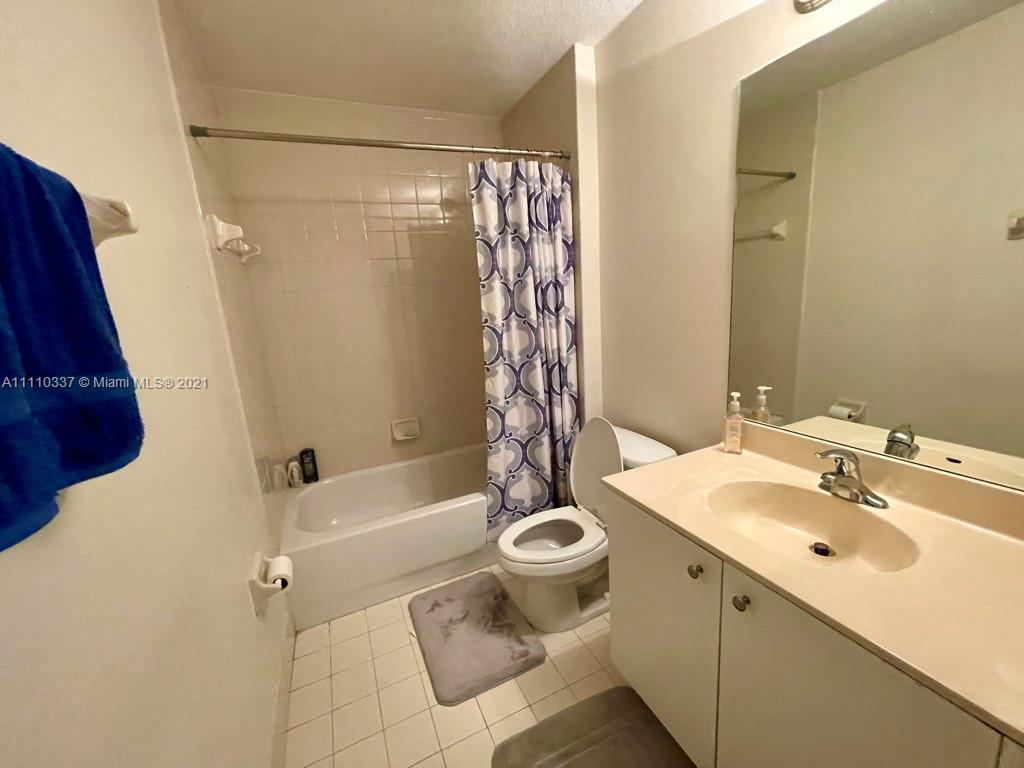 6317 Landings Terrace Tamarac, FL 33321 - Photo 14 of 20 a bathroom with a sink a toilet and shower