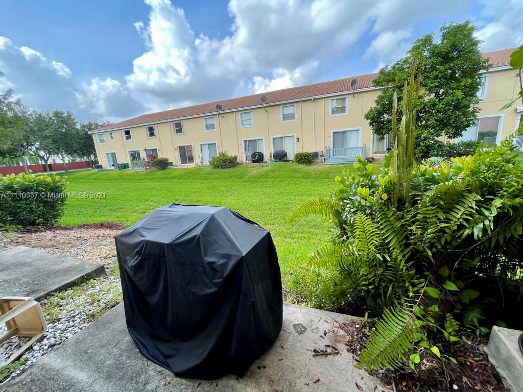 6317 Landings Terrace Tamarac, FL 33321 - Photo 20 of 20 a view of a house with backyard