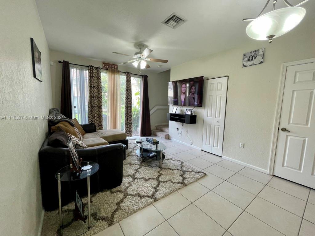 6317 Landings Terrace Tamarac, FL 33321 - Photo 4 of 20 a living room with furniture
