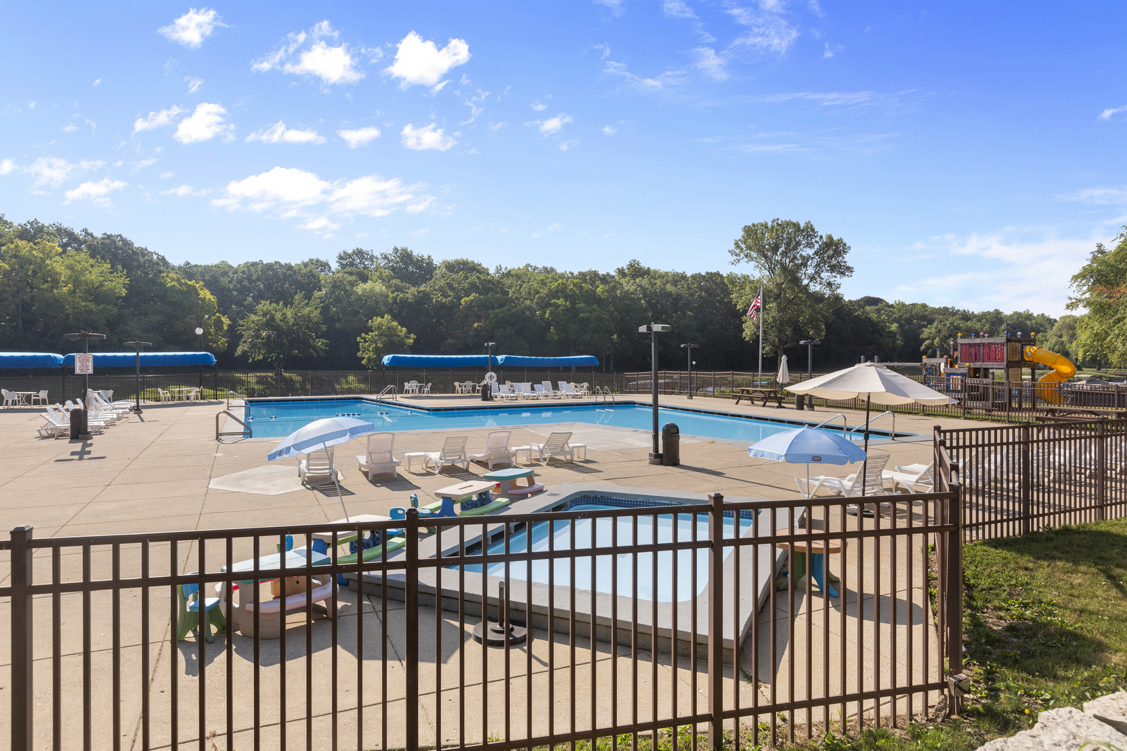 58 Vail Colony, Unit 10 Fox Lake, IL 60020 - Photo 19 of 28 a view of a swimming pool with a lounge chair