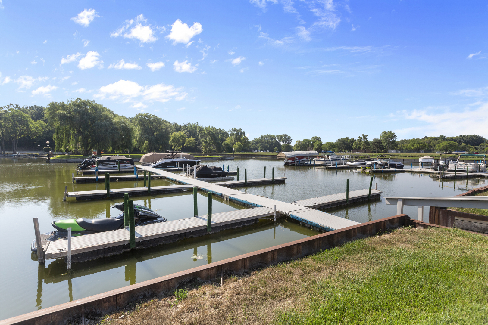 58 Vail Colony, Unit 10 Fox Lake, IL 60020 - Photo 25 of 28 a view of a swimming pool with lounge chairs