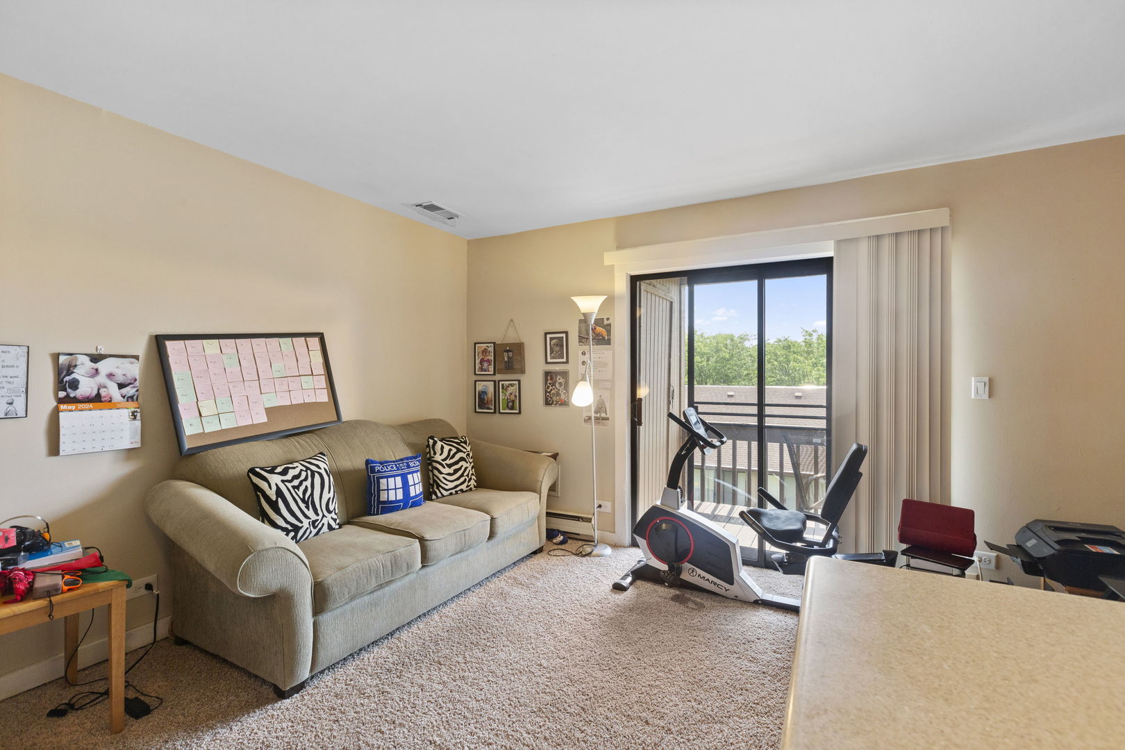 58 Vail Colony, Unit 10 Fox Lake, IL 60020 - Photo 7 of 28 a living room with furniture and a large window