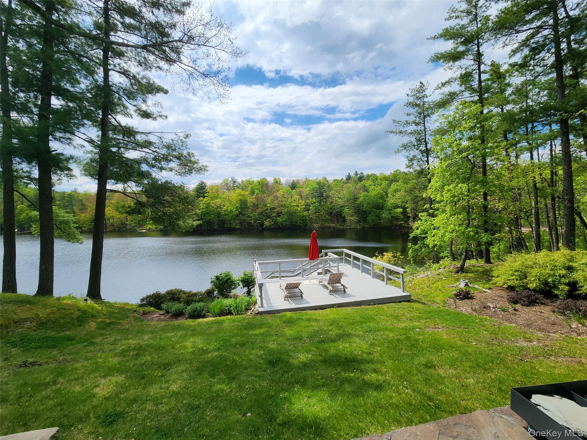 53 Lake Pleasant Road Staatsburg, NY 12580 - Photo 5 of 34 a view of a lake with houses in the background