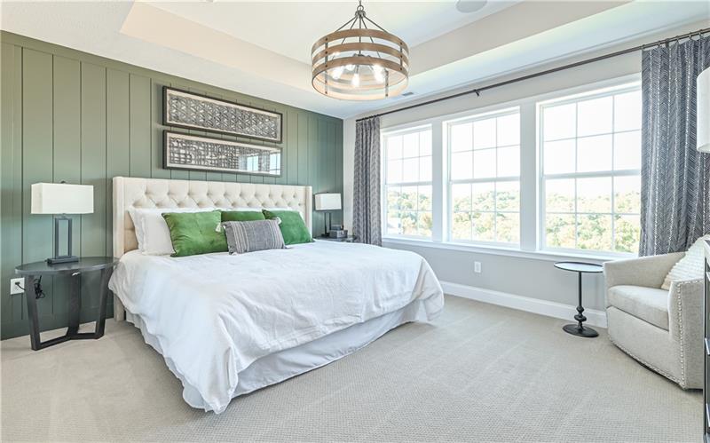 113 Affinity Drive Harmony, PA 16037 - Photo 24 of 40 a bedroom with a large bed and a chandelier