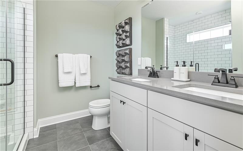 113 Affinity Drive Harmony, PA 16037 - Photo 27 of 40 a bathroom with a toilet sink and mirror