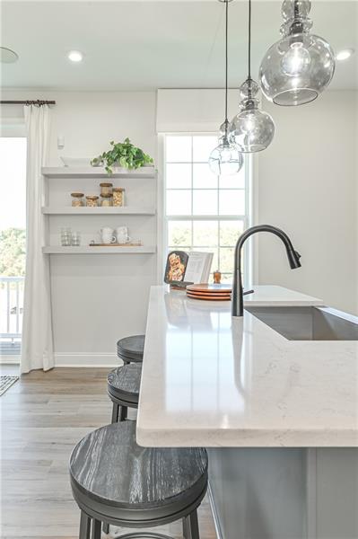 113 Affinity Drive Harmony, PA 16037 - Photo 31 of 40 a kitchen with a table and chandelier