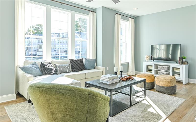 113 Affinity Drive Harmony, PA 16037 - Photo 9 of 40 a living room with furniture a flat screen tv and a large window