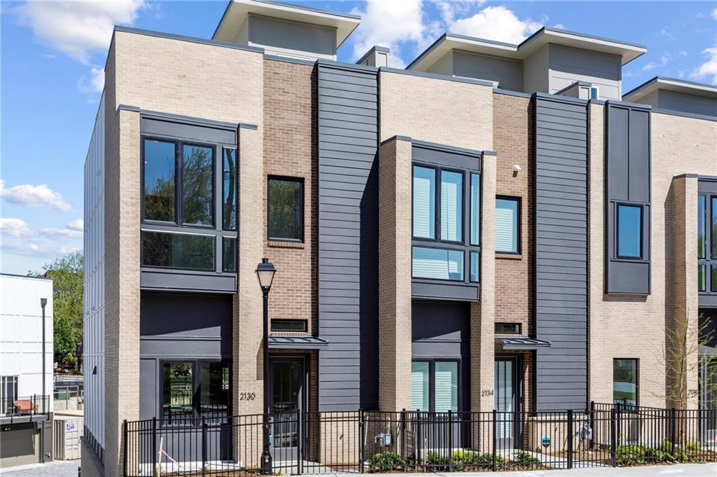 a front view of a residential apartment building with a glass door