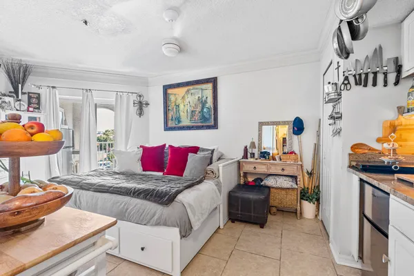 a living room with furniture and a lamp