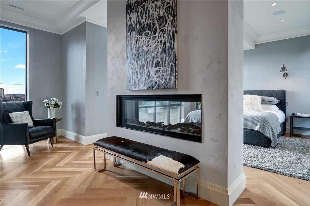 362 Ward Street Seattle, WA 98109 - Photo 13 of 40 a living room with furniture and a fireplace