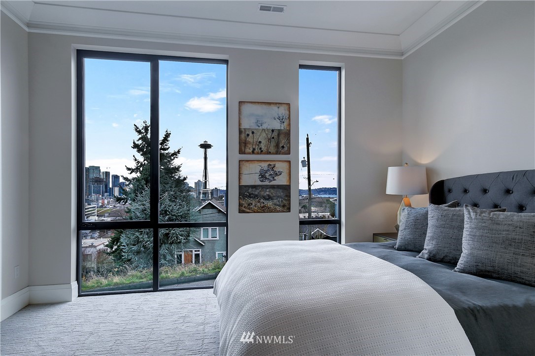 362 Ward Street Seattle, WA 98109 - Photo 14 of 40 a bedroom with a large bed and a window