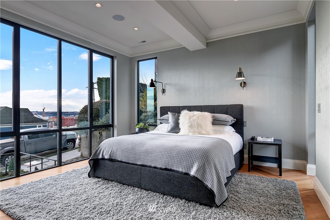 362 Ward Street Seattle, WA 98109 - Photo 15 of 40 a bedroom with a large bed and a large window