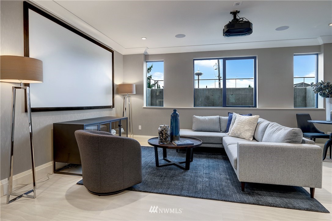 362 Ward Street Seattle, WA 98109 - Photo 25 of 40 a living room with furniture and a lamp