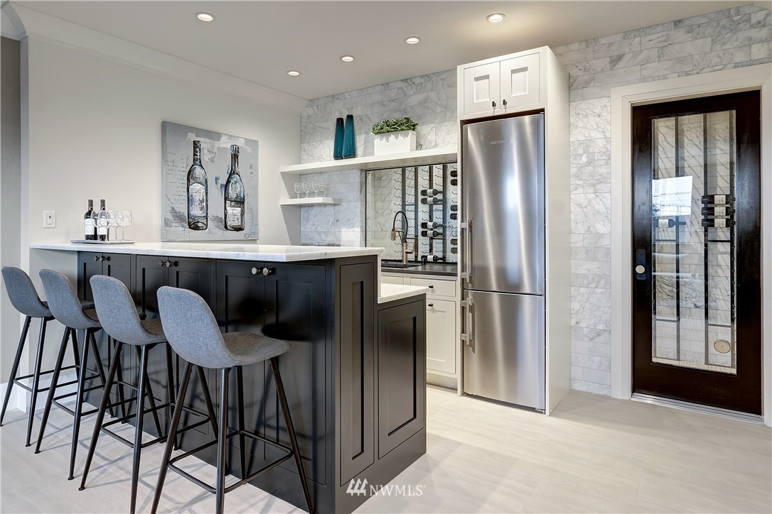 362 Ward Street Seattle, WA 98109 - Photo 26 of 40 a kitchen with stainless steel appliances a refrigerator and microwave