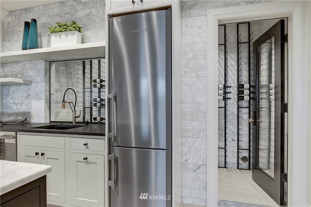 362 Ward Street Seattle, WA 98109 - Photo 27 of 40 a kitchen with stainless steel appliances granite countertop a refrigerator and a sink