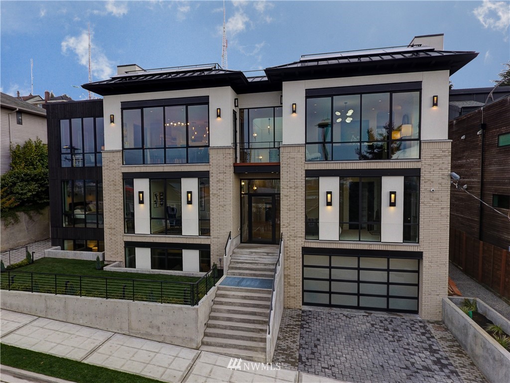 362 Ward Street Seattle, WA 98109 - Photo 34 of 40 a front view of a house with a yard