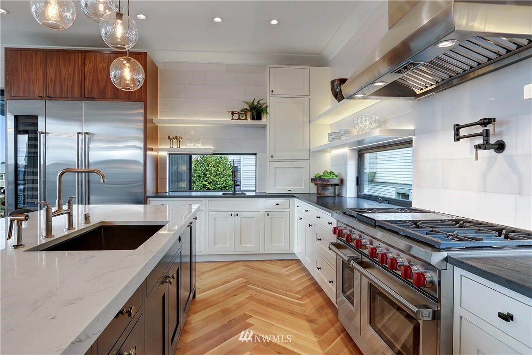 362 Ward Street Seattle, WA 98109 - Photo 9 of 40 a kitchen with granite countertop a stove and a sink