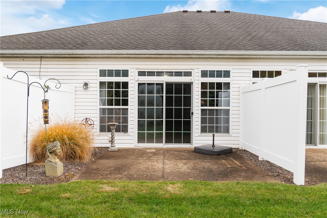7030 Knight Avenue Northwest Canton, OH 44708 - Photo 22 of 26 View of back of property showing private patio off 4-season sun room