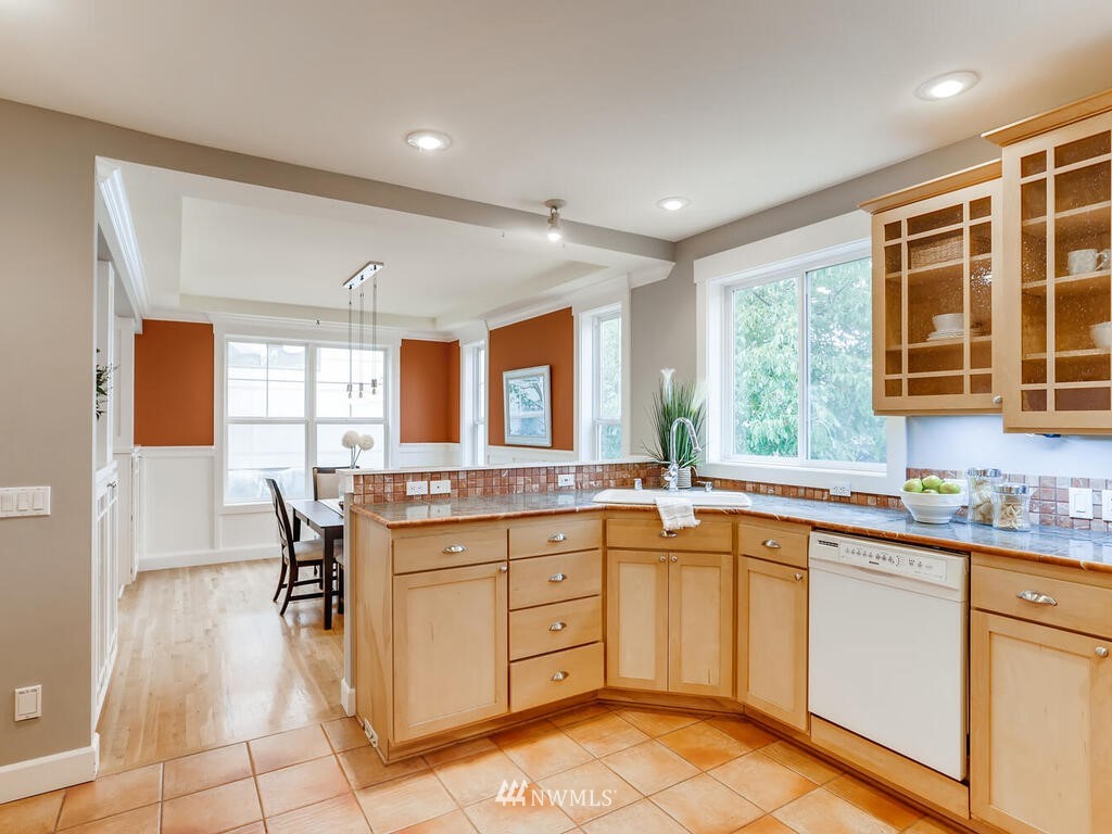 910 North 32nd Street Renton, WA 98056 - Photo 12 of 29 a kitchen with a sink stove and cabinets