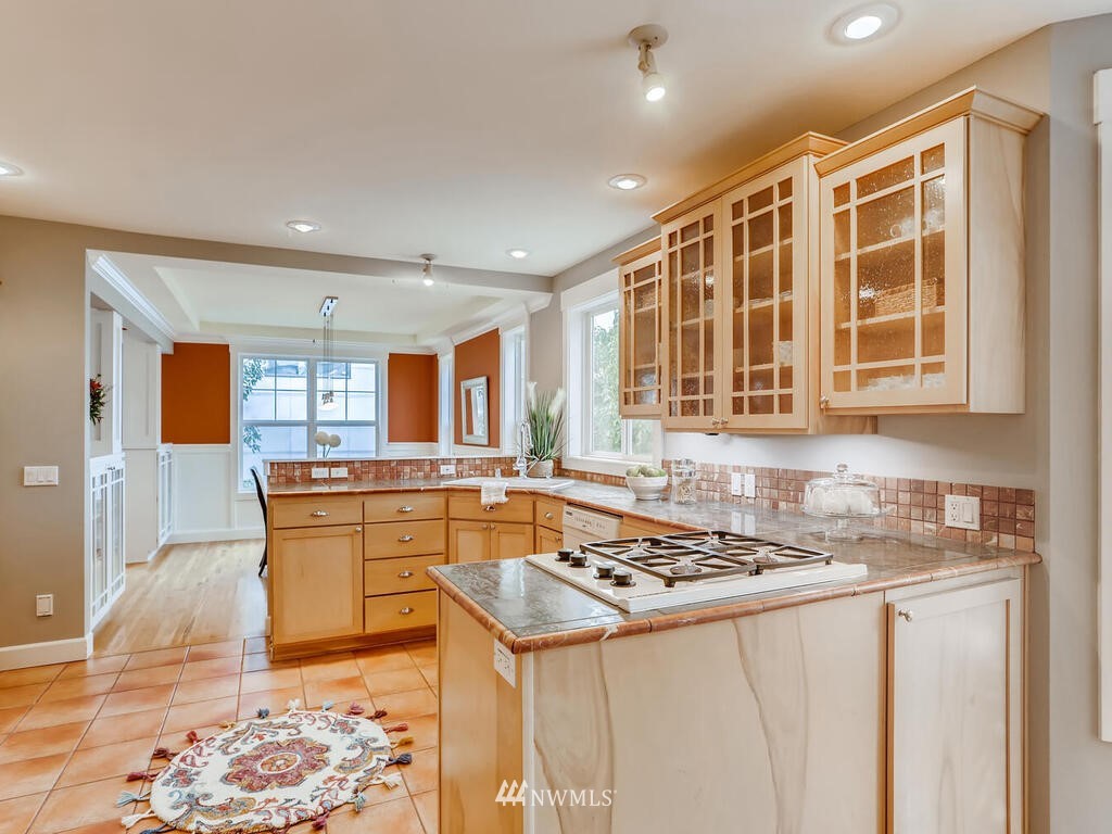 910 North 32nd Street Renton, WA 98056 - Photo 13 of 29 a kitchen with stainless steel appliances granite countertop a stove a sink and a refrigerator
