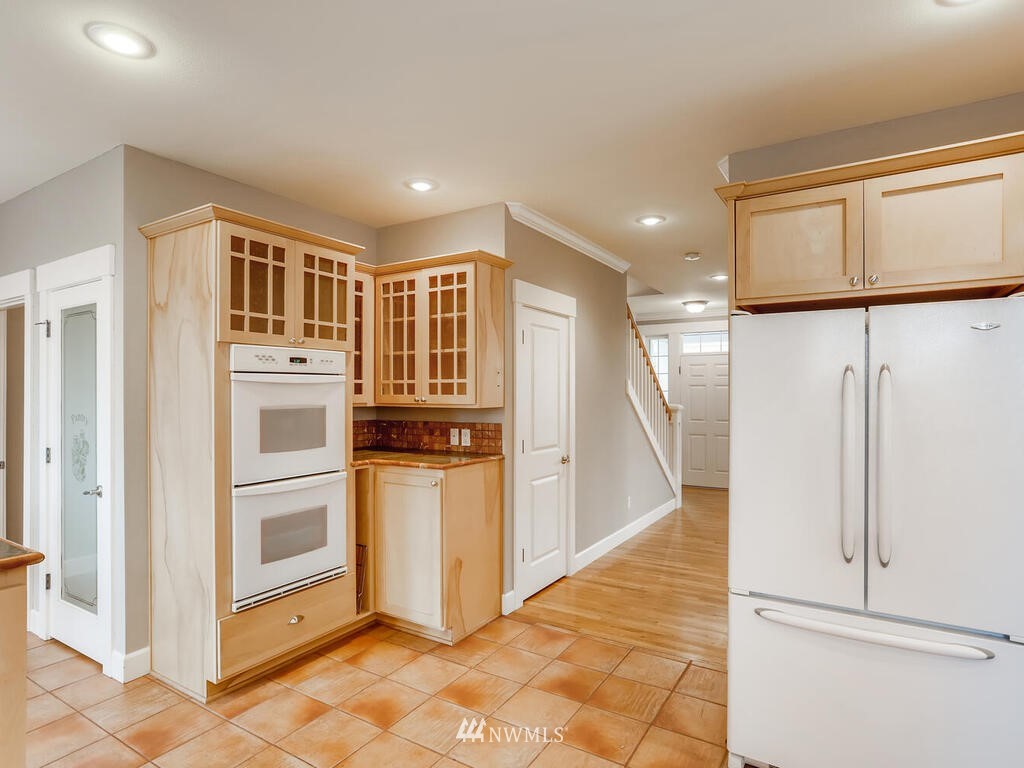 910 North 32nd Street Renton, WA 98056 - Photo 14 of 29 a view of kitchen with stainless steel appliances refrigerator and cabinets