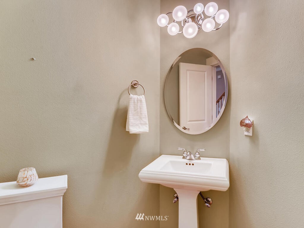 910 North 32nd Street Renton, WA 98056 - Photo 16 of 29 a bathroom with a sink and a mirror
