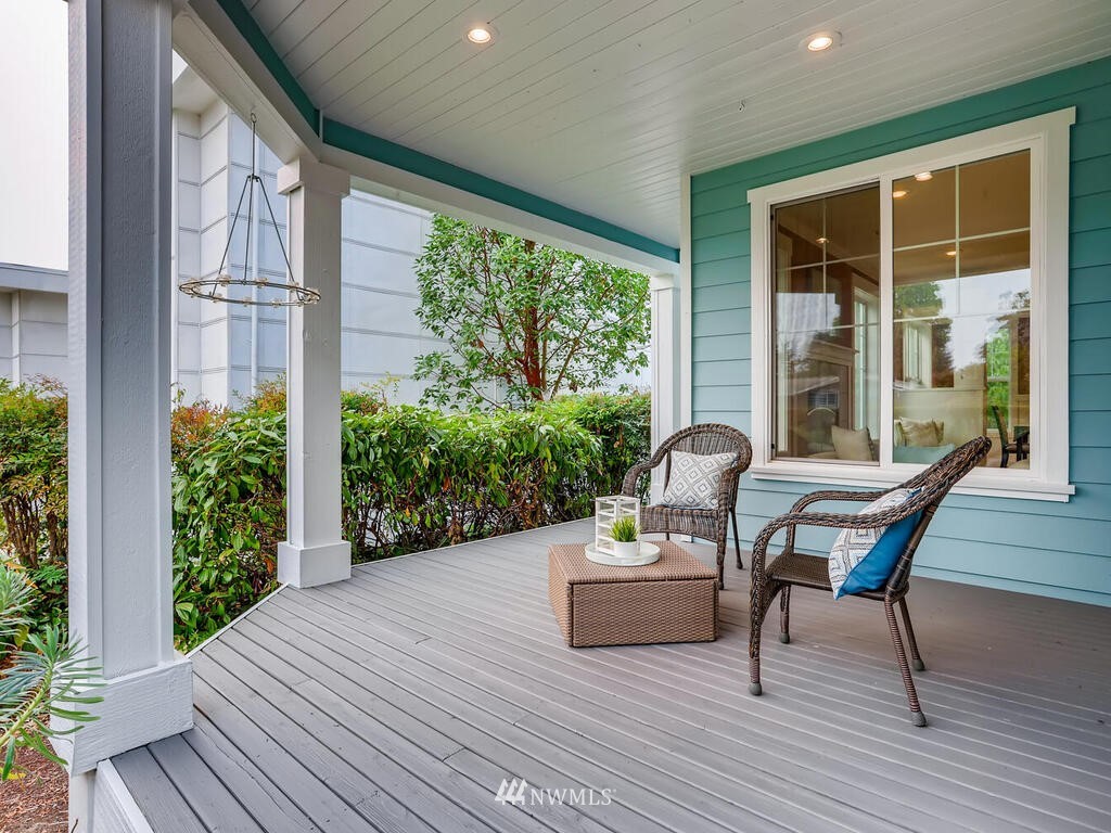 910 North 32nd Street Renton, WA 98056 - Photo 3 of 29 a balcony with furniture and wooden floor
