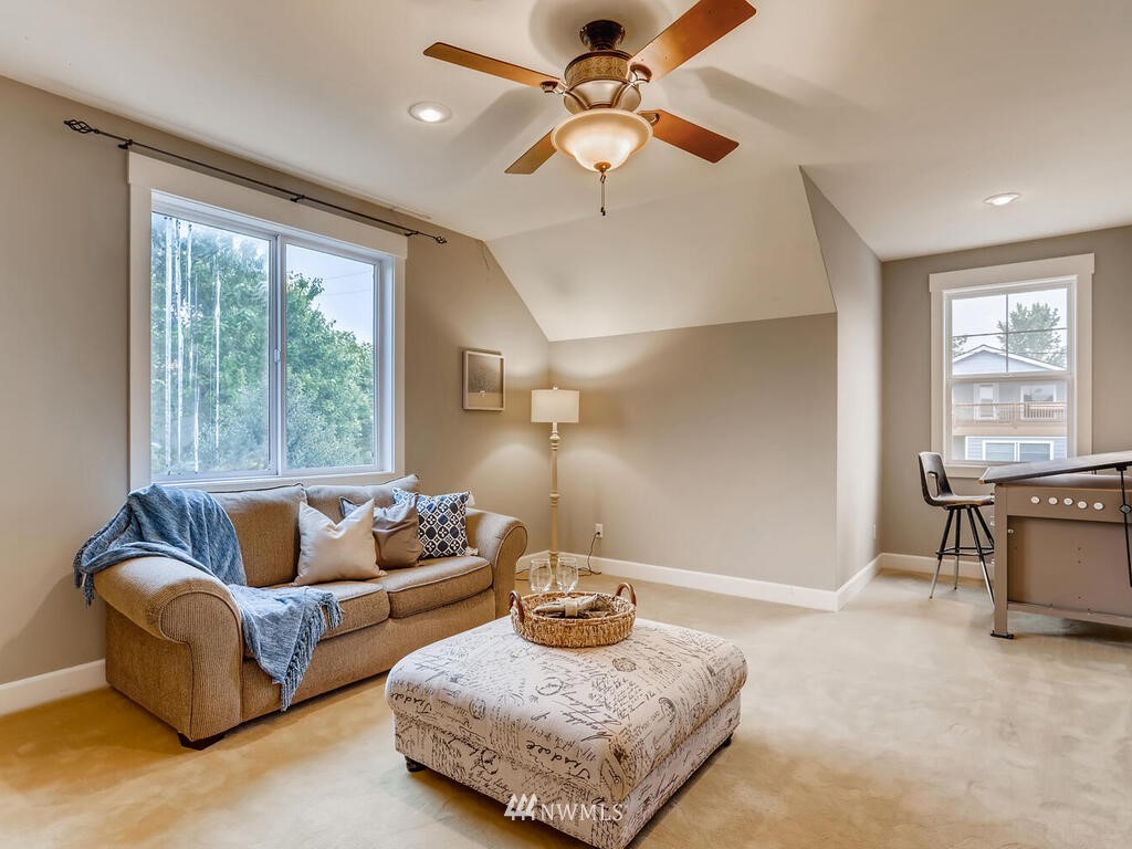 910 North 32nd Street Renton, WA 98056 - Photo 22 of 29 a living room with furniture and a large window
