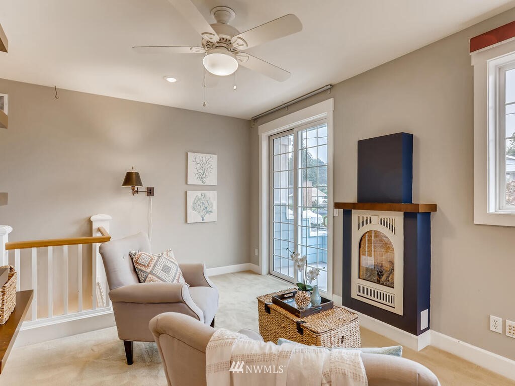 910 North 32nd Street Renton, WA 98056 - Photo 24 of 29 a living room with furniture and a fireplace