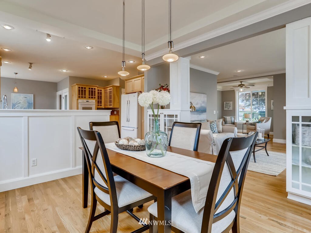 910 North 32nd Street Renton, WA 98056 - Photo 10 of 29 a view of a dining room with furniture and wooden floor