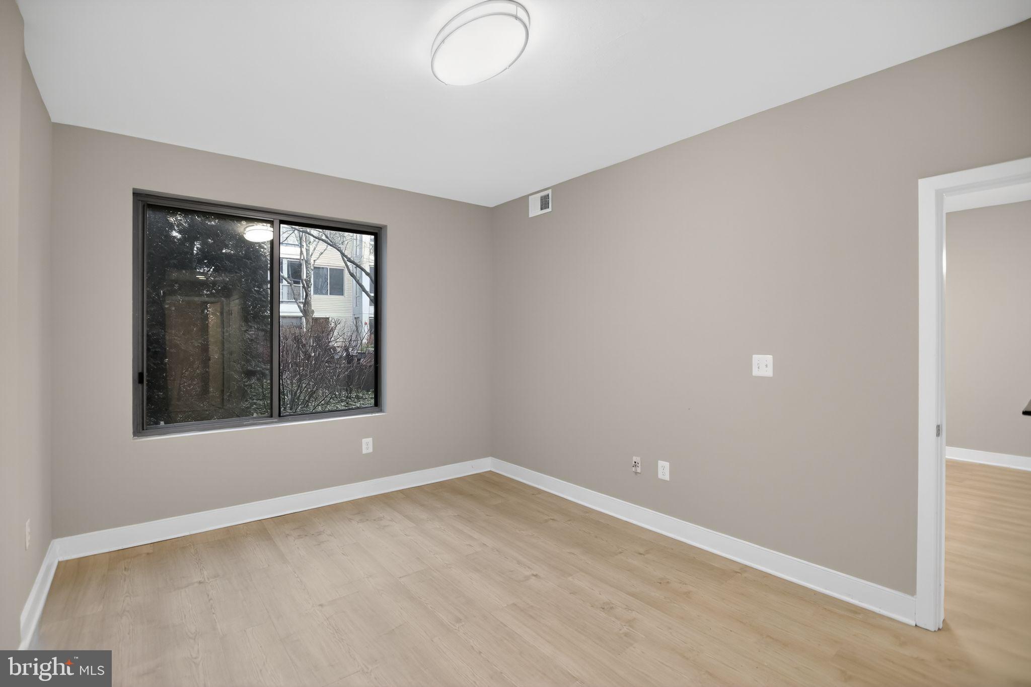 4101 Albemarle Street Northwest, Unit 317 Washington, DC 20016 - Photo 12 of 32 an empty room with a window