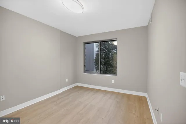 a kitchen with stainless steel appliances granite countertop a sink refrigerator and cabinets