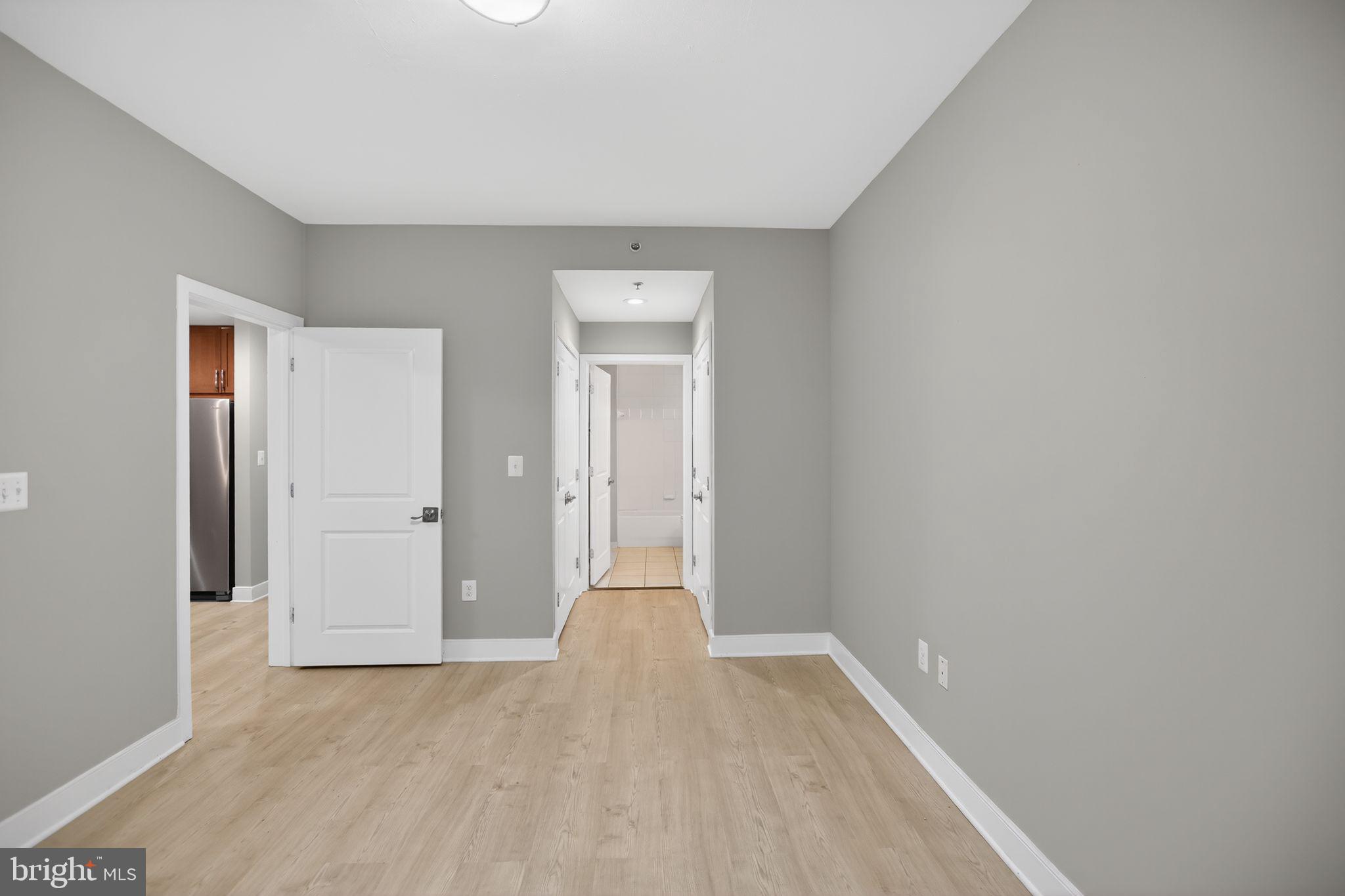 4101 Albemarle Street Northwest, Unit 317 Washington, DC 20016 - Photo 23 of 32 wooden floor in an empty room
