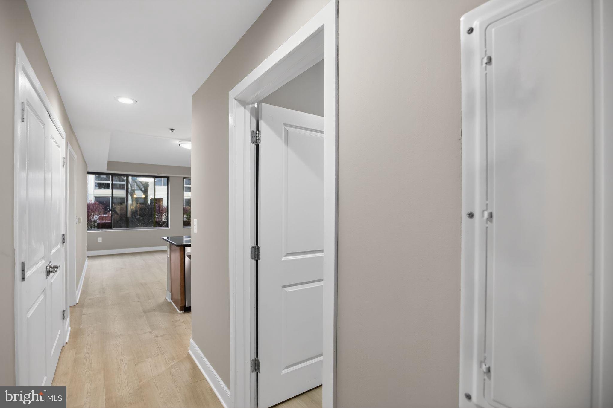 4101 Albemarle Street Northwest, Unit 317 Washington, DC 20016 - Photo 31 of 32 a view of a hallway with wooden shelves