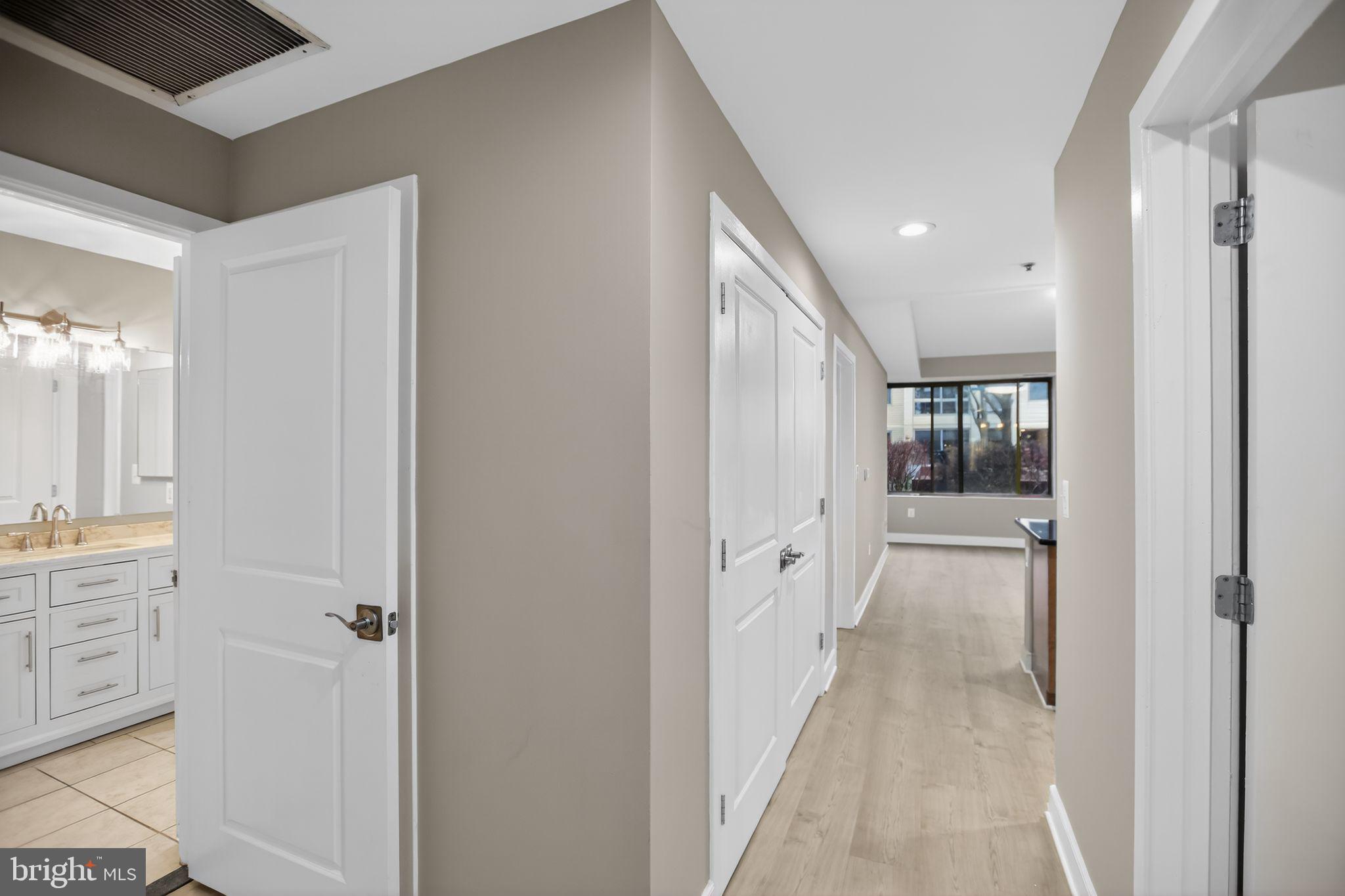 4101 Albemarle Street Northwest, Unit 317 Washington, DC 20016 - Photo 32 of 32 a view of a hallway with wooden floor