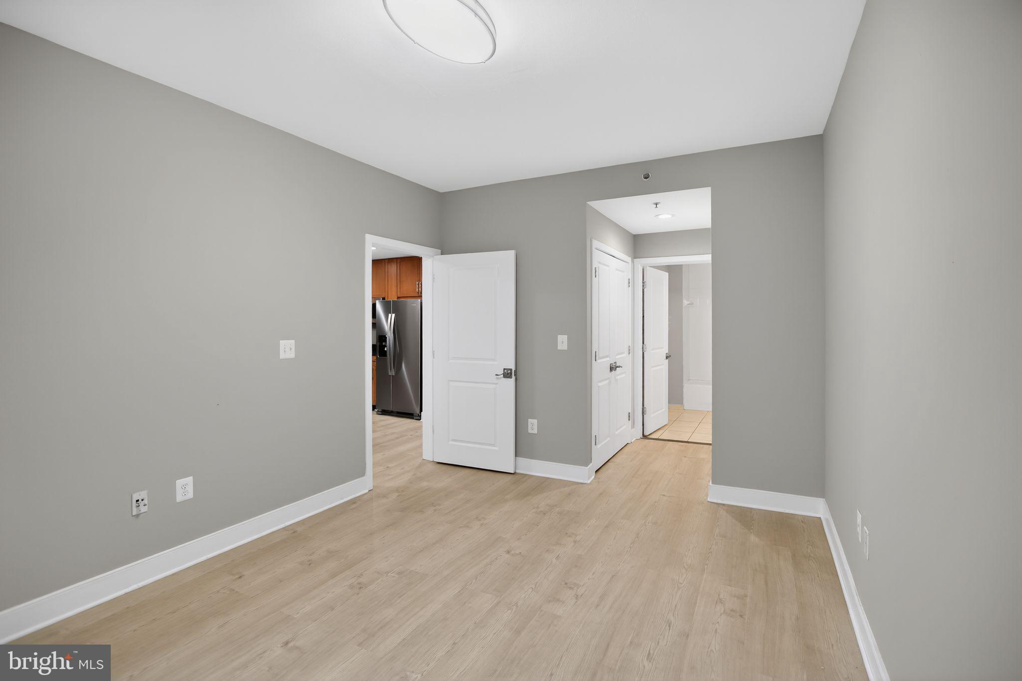 4101 Albemarle Street Northwest, Unit 317 Washington, DC 20016 - Photo 9 of 32 a view of entryway with wooden floor