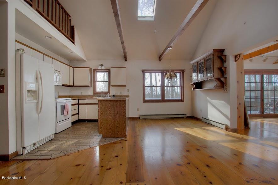 27 A Birch Road Copake, NY 12516 - Photo 8 of 16 a kitchen with stainless steel appliances a refrigerator and a stove top oven