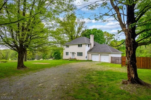 a house with huge green field in front of it