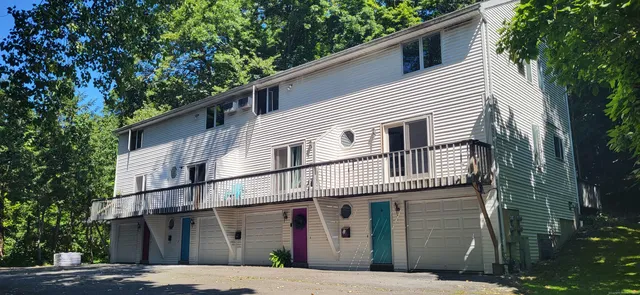 a view of a white house with a large windows