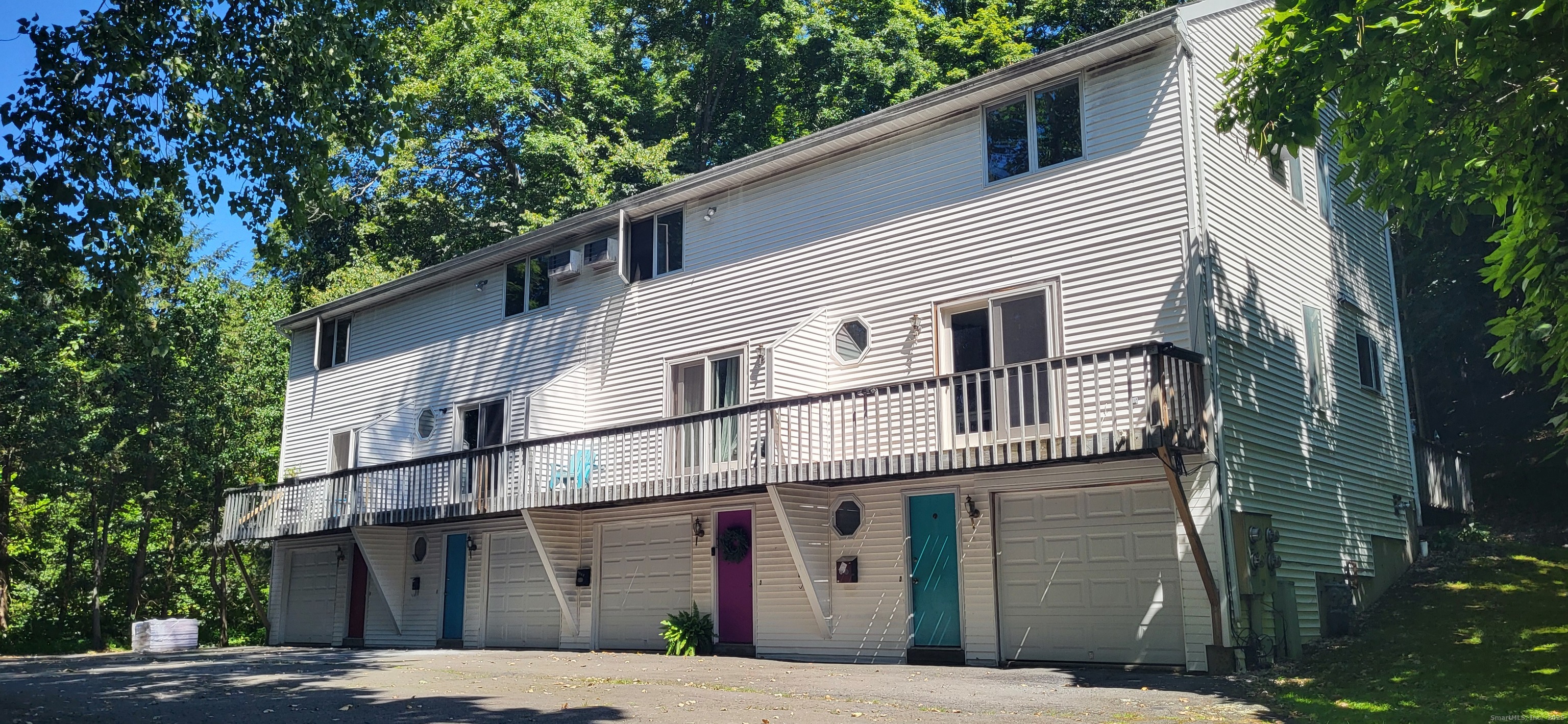 a view of a white house with a large windows