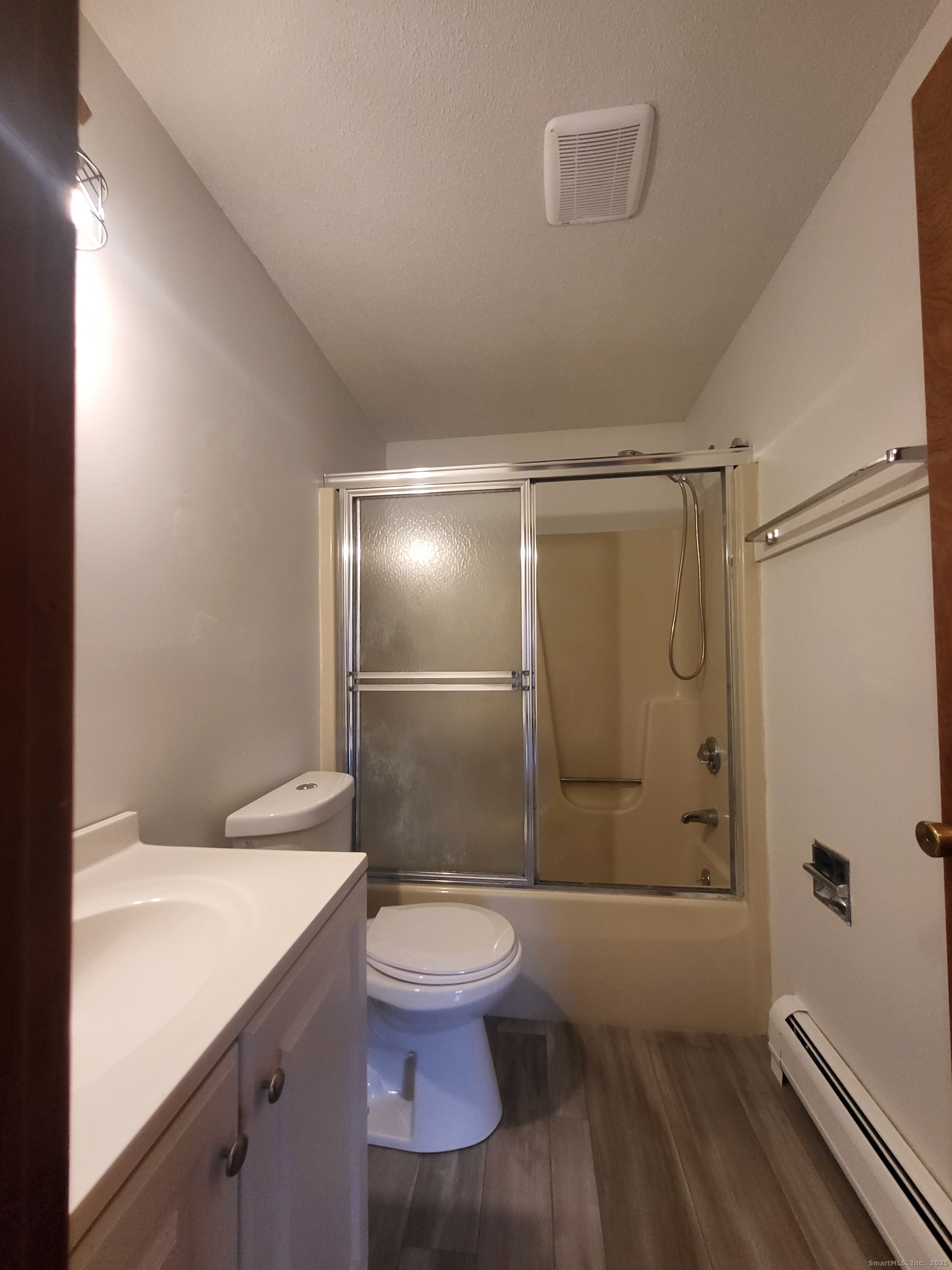 1730 Farmington Avenue, Unit A Farmington, CT 06085 - Photo 7 of 10 a bathroom with a granite countertop sink toilet and shower