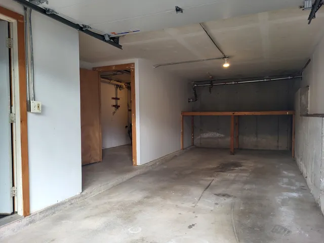 a view of an empty room with a fireplace