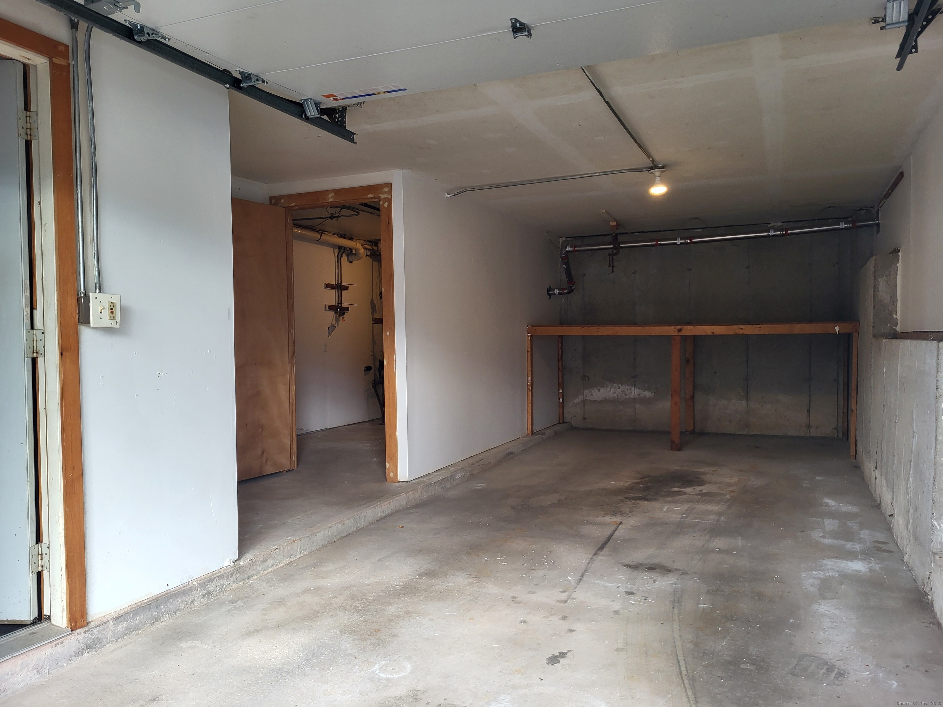 1730 Farmington Avenue, Unit A Farmington, CT 06085 - Photo 8 of 10 a view of an empty room with a fireplace